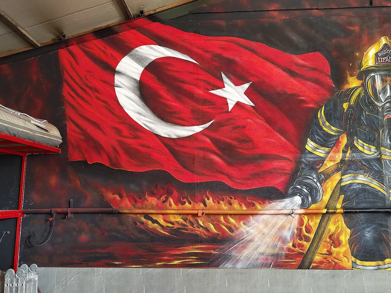 Wavy Turkish flag graffiti wall painting detail created with spray paint.
