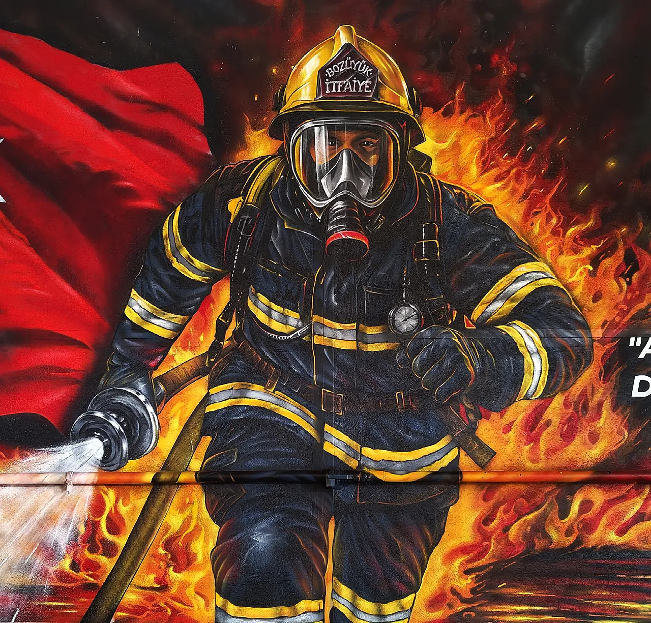 Firefighter running through a fire - graffiti detail on a wall painting.