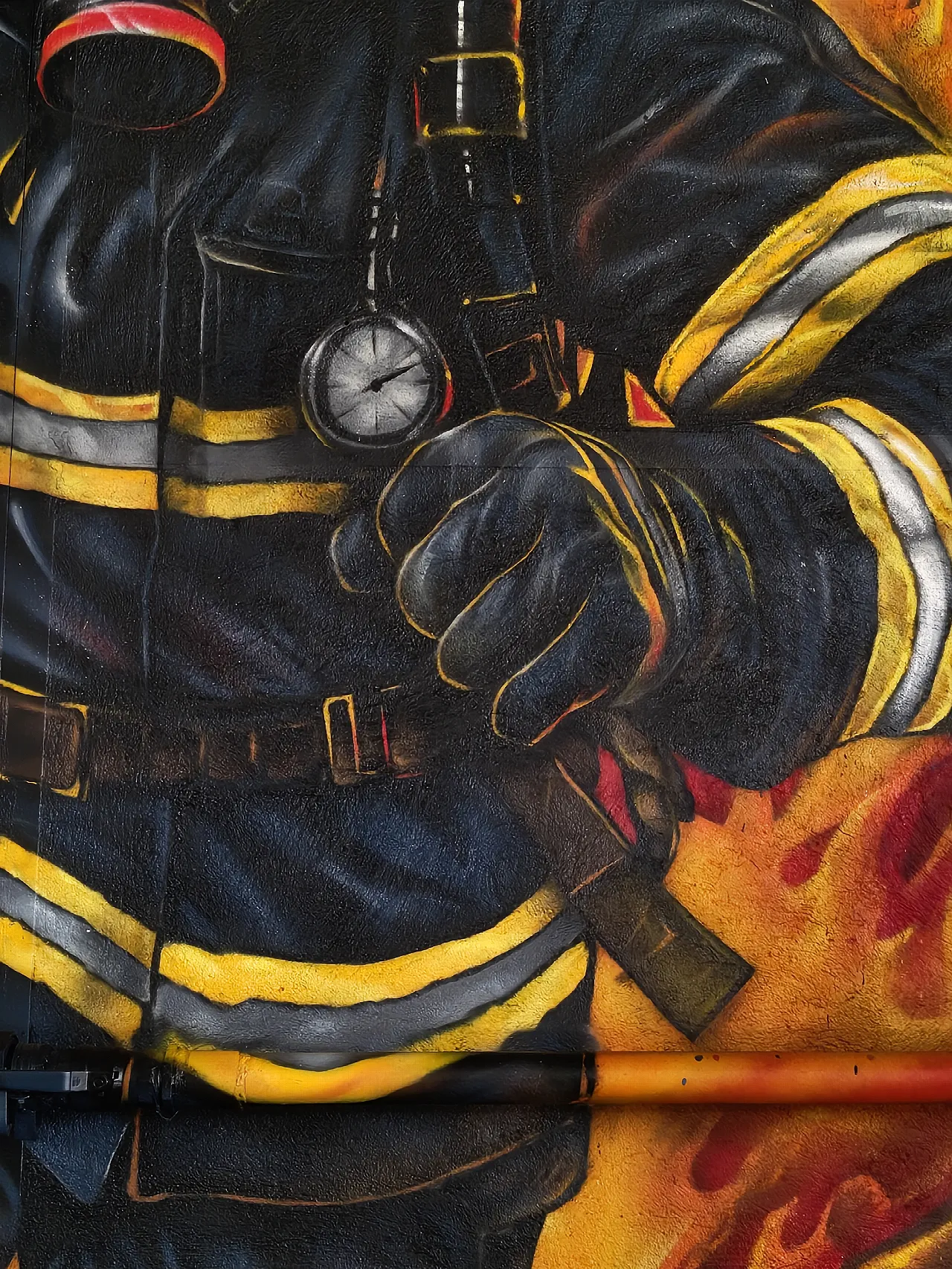 Firefighter uniform, gloves, graffiti mural detail