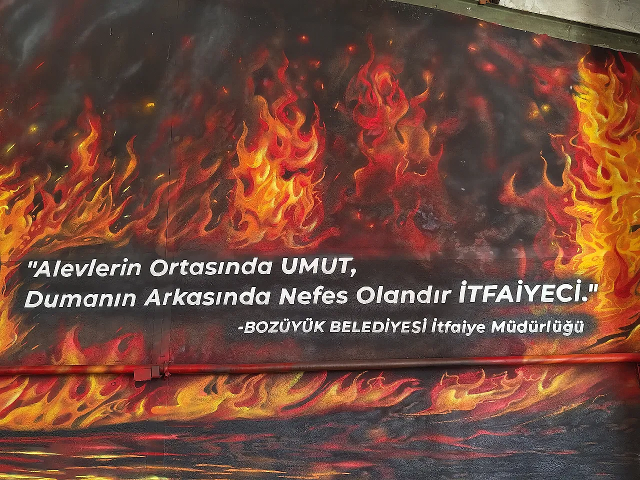 Amidst the flames, the firefighter is the hope, the breath of fresh air.